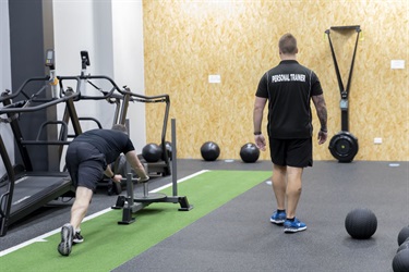 Trainer and client training indoors