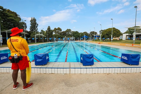 Lifeguard watching outdoor pool