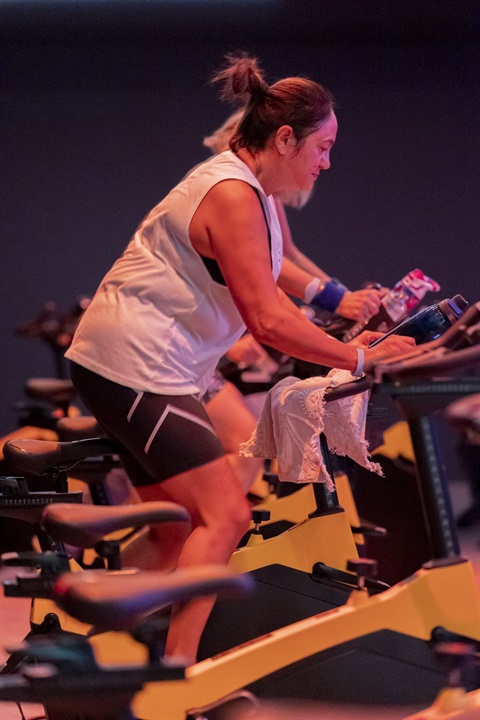 Participant riding bike in Cycle Group Fitness Class.jpg