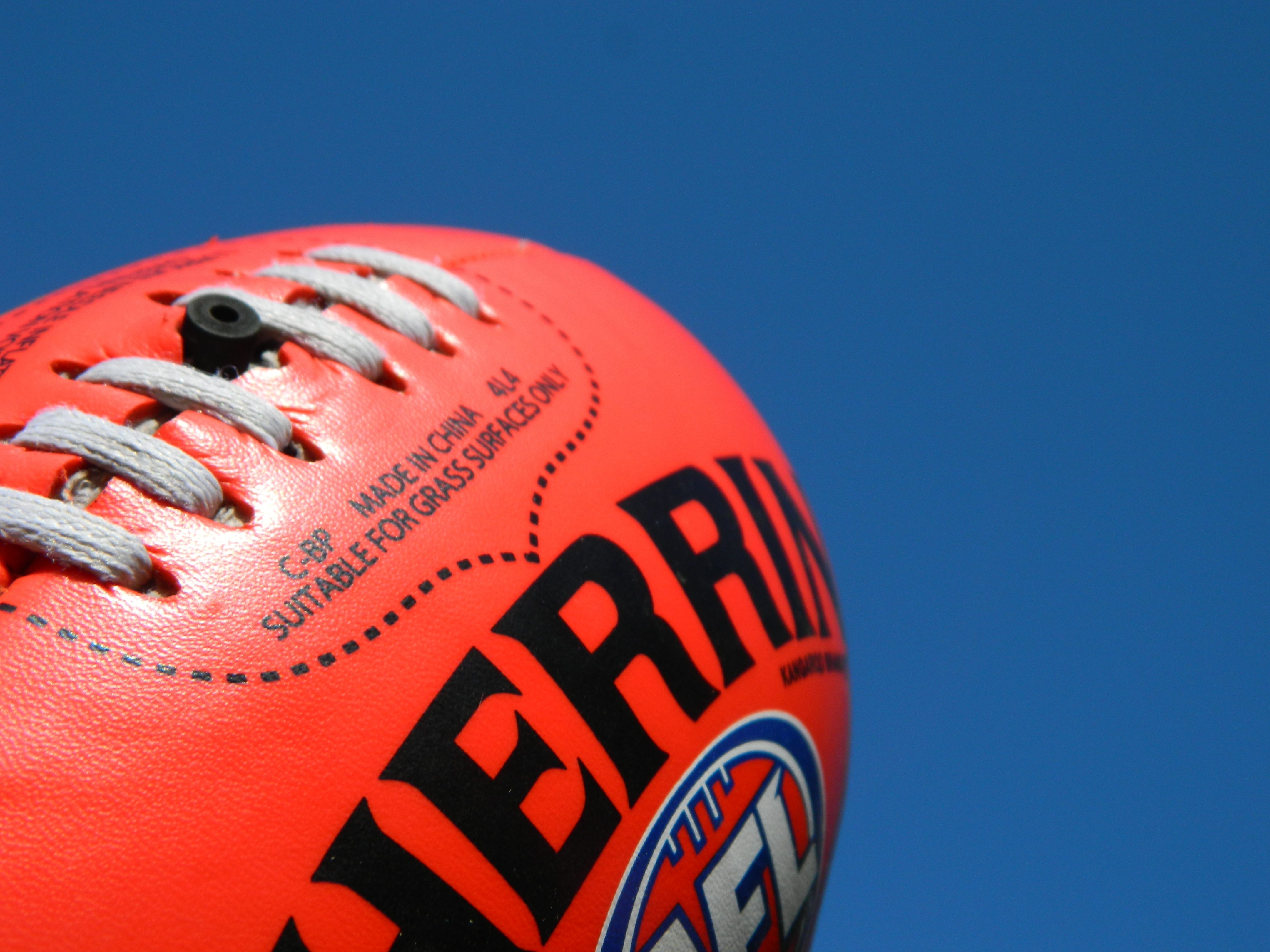 AFL Football against blue background