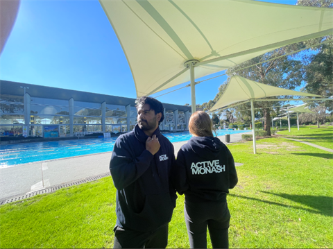 People wearing Active Monash hoodie with the front and back on display..png